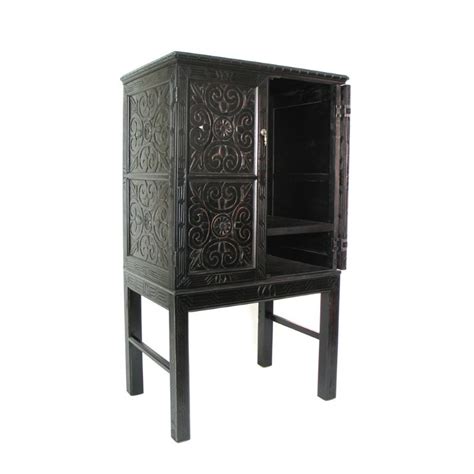 An entertainment center within an armoire accommodates all the various electronic equipment you may have, such pier 1 offers this adorable cottage antique white entertainment armoire. Pemberly Row TV Armoire in Antique Black - PR-1552791