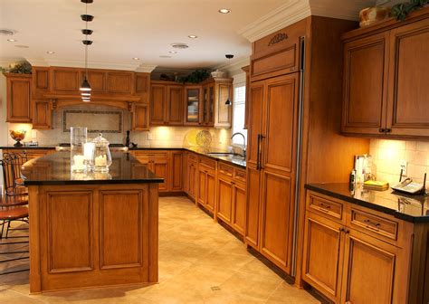 Maple cabinets that have red undertones, such as armstrong's bordeaux or holly from cabinets delivered, pair nicely with hardwood flooring in a mahogany stain. Maple cabinets with black countertop and light tile backsplash (With images) | Kitchen remodel ...