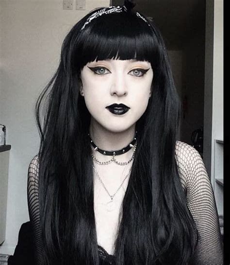 Woman With Dyed Black Hair And Blunt Bangs With Gothic Makeup And