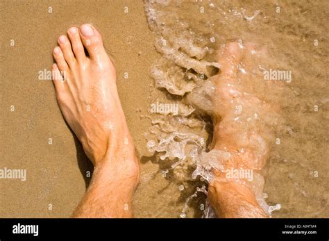 Bare Feet In Water Stock Photo Alamy