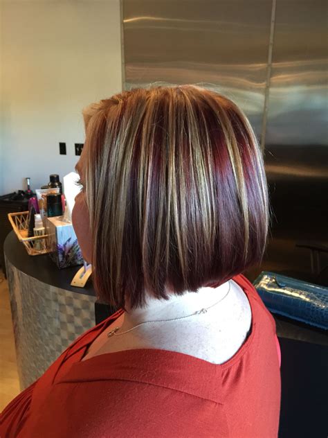 Red Underneath With Blonde Highlights And Dimensional Lowlights Bob