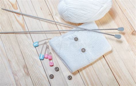 Knitted Sweater With Pins And Buttons Stock Photo Image Of Sewing