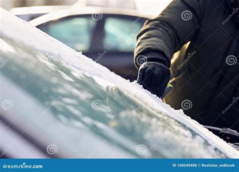 Man Scraping Ice From The Windshield Of A Car Stock Photo Image Of