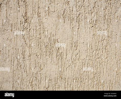 Beige Textured Wall With Plaster Applied With Putty Knife In Irregular