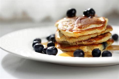 Pancakes With Blueberries And Maple Syrup Sweet Breakfast Stock Photo