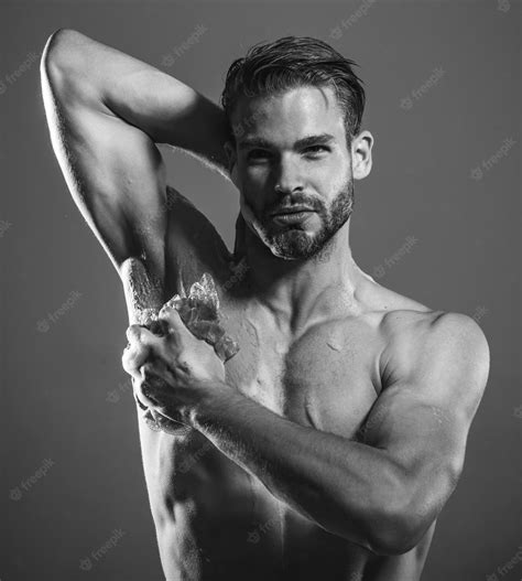 Premium Photo Bearded Macho Guy With Strong Muscles Taking Shower