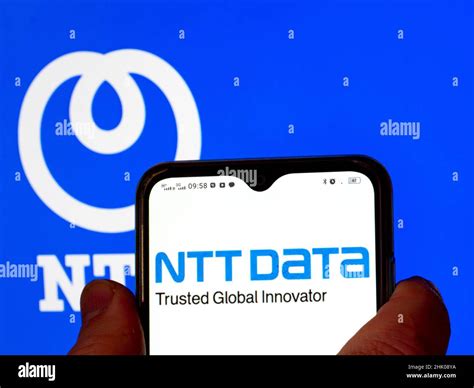 In This Photo Illustration The Ntt Data Logo Is Displayed On A Smartphone Screen With A Nippon