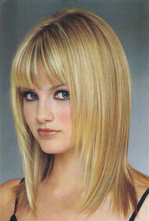 This red toned chestnut style sports sweeping bangs, thick upper layers and wispy lower ones. Hairstyles For Long Hair 2013 Women