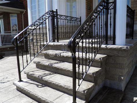 Smiling business woman standing on stairs at office building and holding h. Best Outdoor Stair Railings from Wood, Glass, Wrought Iron