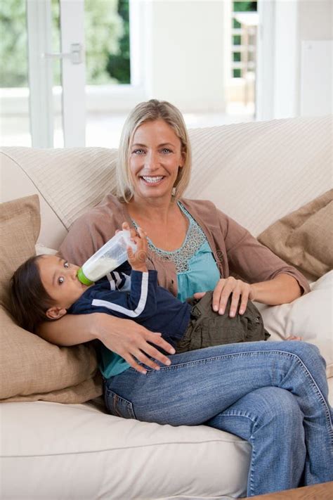 Mother Giving A Bottle Of Milk To Her Son Stock Image Image Of Peaceful Daughter 18254143