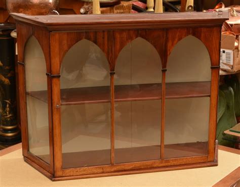 If you have little budding mountain climbers or live in move the curio cabinet away from the wall and locate the studs behind it. Sold Price: Gothic Revival mahogany wall hung curio ...