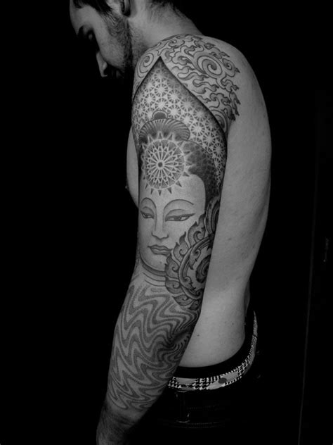Gautama buddha with lotus flower tattoo design. 131 Buddha Tattoo Designs That Simply Get it Right