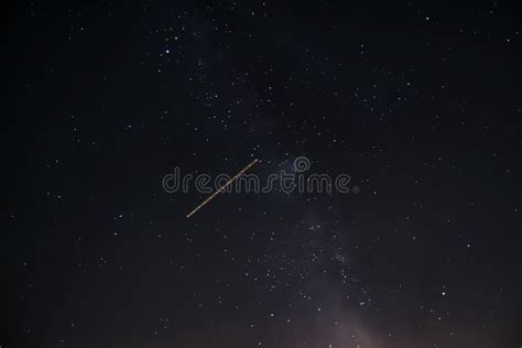 Beautiful Shot Of A Shooting Star In A Starry Night Sky Stock Photo