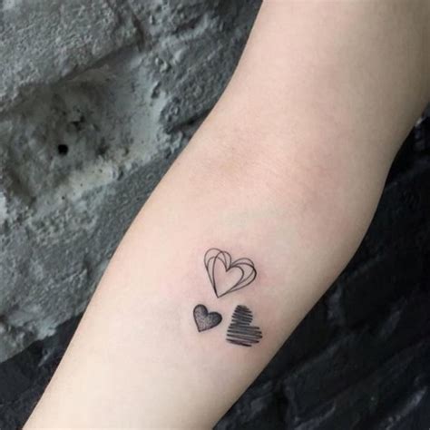 Two Hearts Intertwined Tattoos