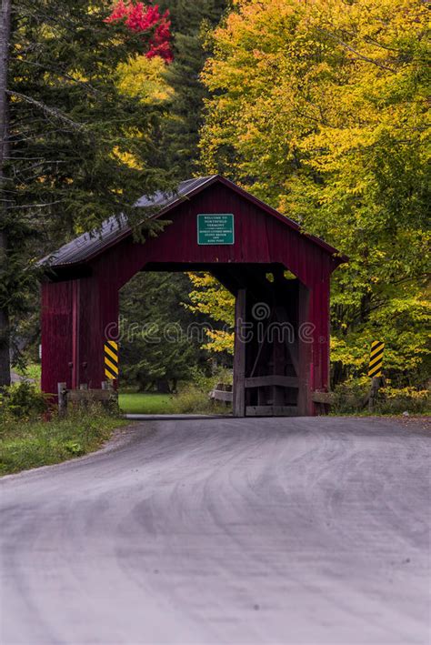 Red Covered Bridge And Gravel Road Autumn Fall Vermont Stock
