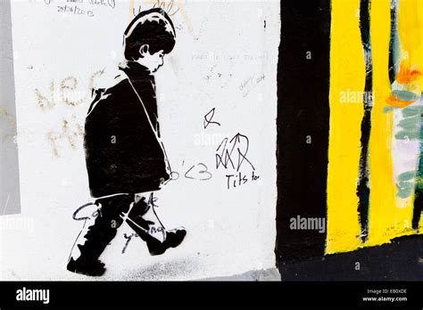 Berlin Wall Street Art Graffiti Banksy Style Boy Stock Photo Alamy