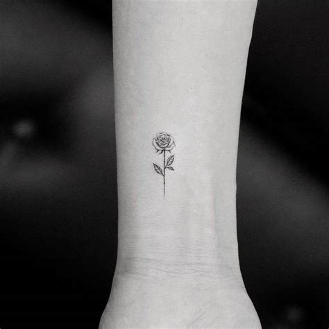 If you like the tiny tattoos, then take a look at this. Tiny Rose Tattoos That Will Be Blooming All Year Long