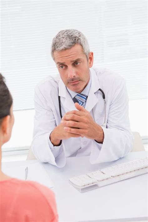 Patient Consulting A Serious Doctor Stock Photo Image Of Serious