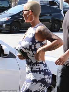 Amber Rose Enjoys A Lollipop As She Heads Out Of Nail Salon In Los
