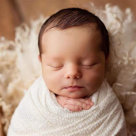Adorable Newborn Boy In White And Ivory