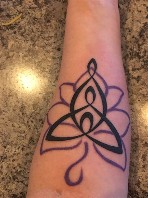Maa with lotus tattoo design on wrist. Celtic mother and children with lotus | Celtic mother ...