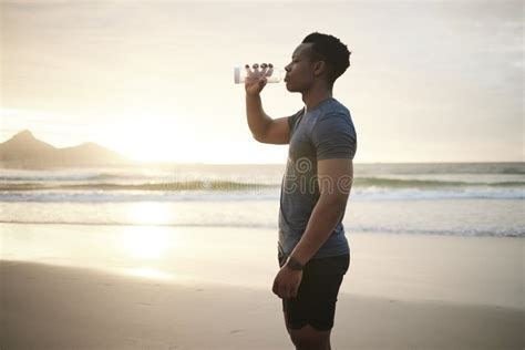 Fit Man Drinking Water Taking A Break Young African American Athlete