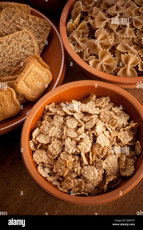 Whole Grain Carbohydrates On Wooden Table Stock Photo Alamy