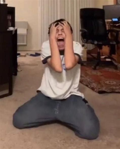 guy screaming on bedroom floor wirth hands on his hand on his knees reaction image day 2 no