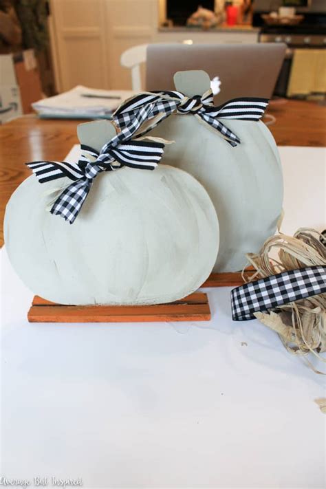 What a great way to make a full wall home decor piece with all the dollar tree is full of crafty inspiration! DIY Dollar Tree Pumpkin Picture Frames - Average But Inspired