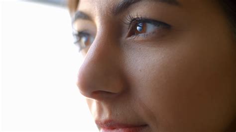 Extreme Close Up Of A Young Womans Face Blinking And Smiling Stock