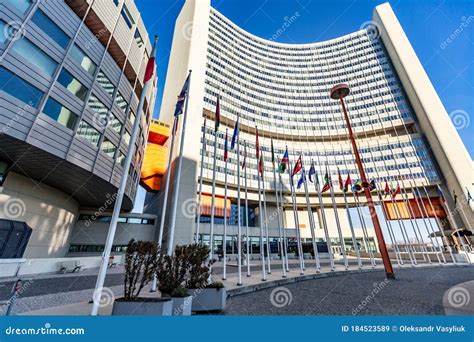 Un Building In Vienna Austria With Flags On A Sunny Day Against The