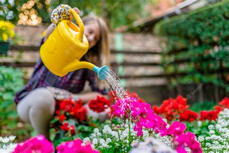Premium Photo Woman Watering Flower Garden Plants Woman Taking Care Of Her Plants And