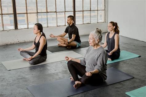premium photo diverse people meditating in a yoga class
