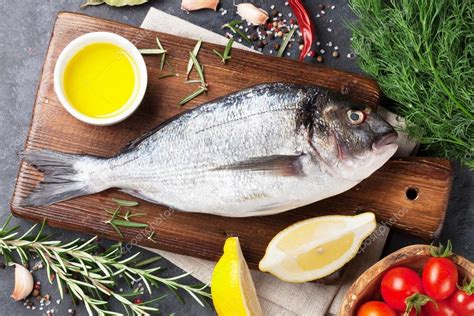 Raw Fish With Ingredients — Stock Photo © Karandaev 124948990