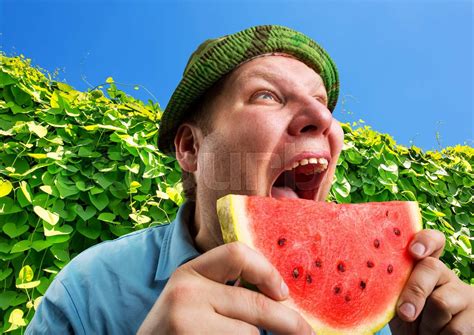 Bizarre Man Eating Watermelon Stock Image Colourbox
