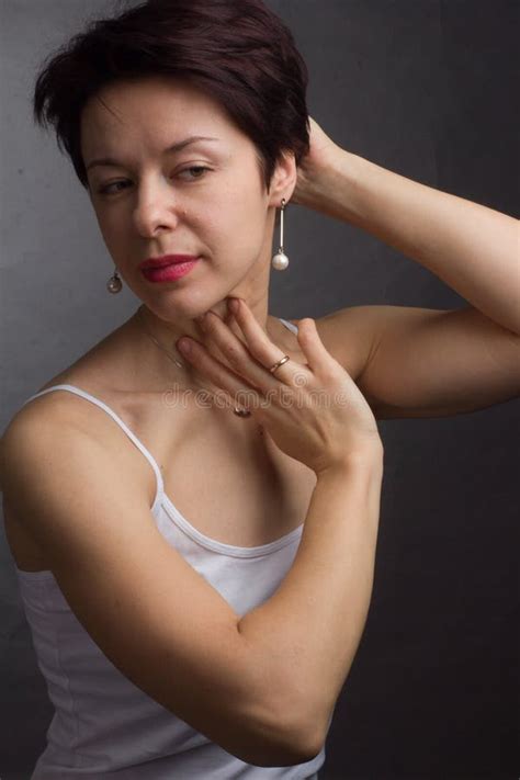 Brunette With Short Hair Studio Portrait In White T Shirt Stock Image