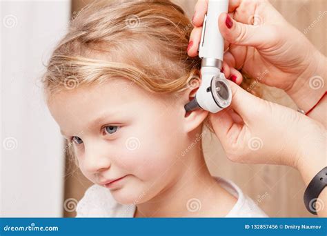 Child Ent Check Doctor Examining Ear Of A Little Girl With Otoscope