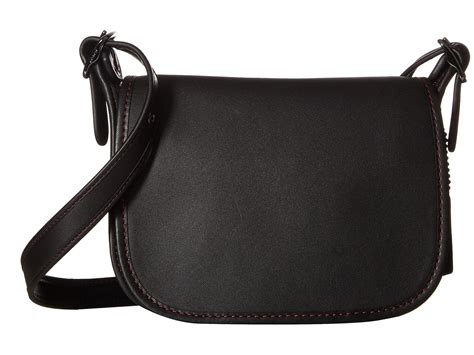 To carry with your fingertips or slipped under your arm, these bags add the ultimate touch of sophistication and femininity to every outfit. Coach Glovetanned Leather Saddle Bag 18 in Black | Lyst