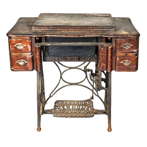 Antique New Home Sewing Machine With Cabinet Ebth