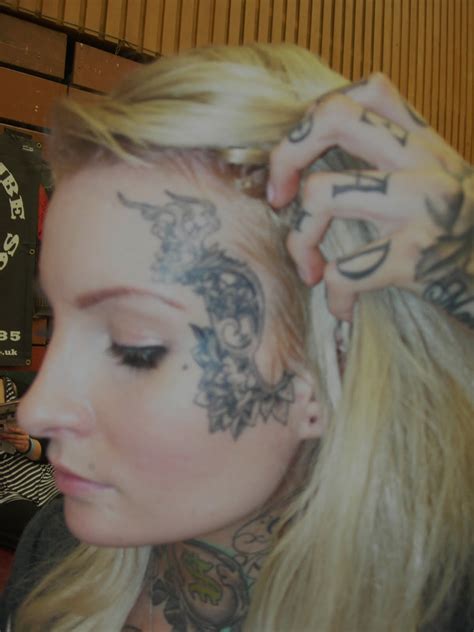 10 Best Face Tattoo Designs For 2015
