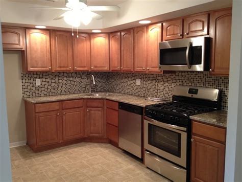 Kitchen color ideas with maple cabinets. What flooring was used? Need ideas to go with toffee maple ...