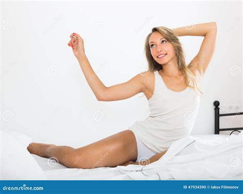 Woman Stretching On Bed Stock Photo Image
