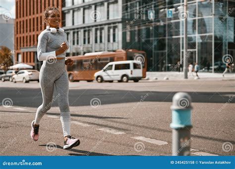 Female Jogger Having Regular Training Outdoors On A Sunny Day During