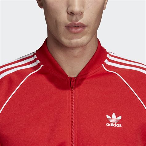 In today's unboxing video, we'll be receiving and opening the stylish adidas track jacket sst, in the large size, and having an overview of this amazing. Adidas Originals SST Track Jacket (collegiate red)