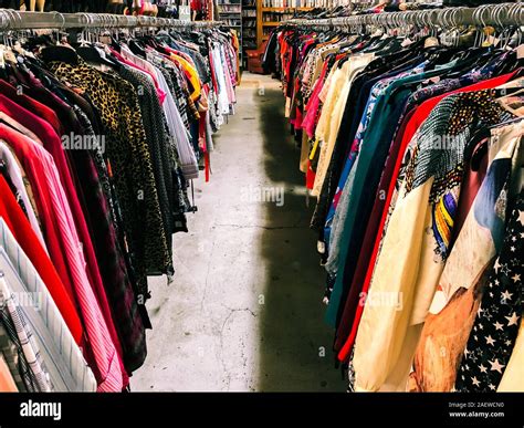 Used Clothes On Hangers In Second Hand Stock Photo Alamy