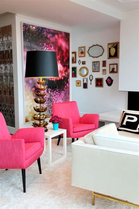 This england living room leans into cheery, sunny vibes with twin yellow sofas paired with tons of colorful accents. Living Room | Hot Pink Chairs - Amazing House Design