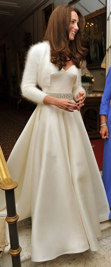 Kate middleton arrives at westminster abbey wearing a stunning white gown with long lace sleeves and a suprisingly plunging neckline. Kate Middleton's Second Wedding Dress | Reader's Digest