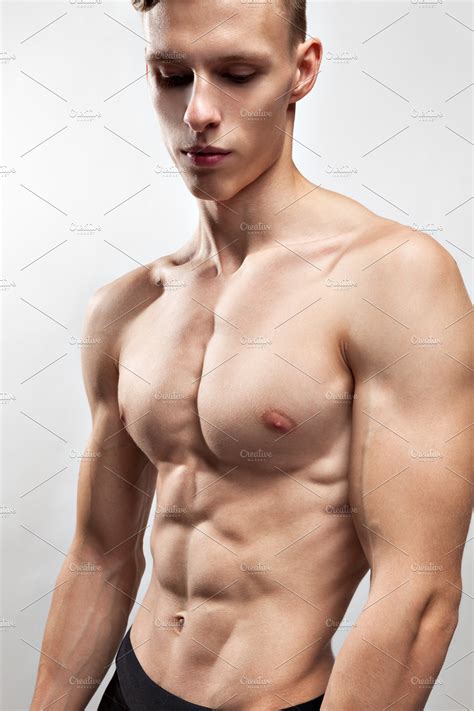 Individual muscles are separated from other muscles and held in position by. young man with a muscular torso | High-Quality Sports Stock Photos ~ Creative Market