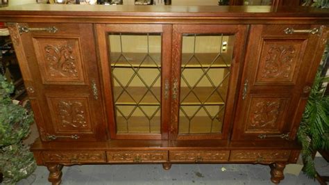 Maybe you would like to learn more about one of these? Beautiful vintage German carved china cabinet, with leaded d