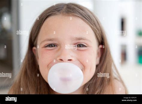 Girl Blowing Bubblegum Stock Photo Alamy